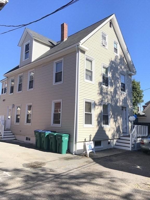 view of home's exterior featuring a chimney