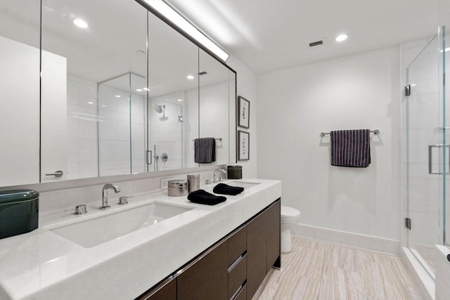 full bath featuring visible vents, toilet, a stall shower, and vanity