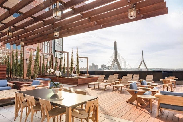 wooden terrace featuring outdoor dining area