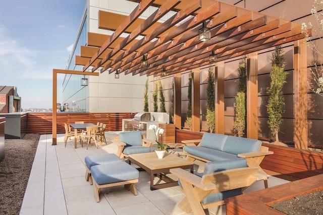 view of patio / terrace featuring an outdoor living space, an outdoor kitchen, outdoor dining space, and a pergola