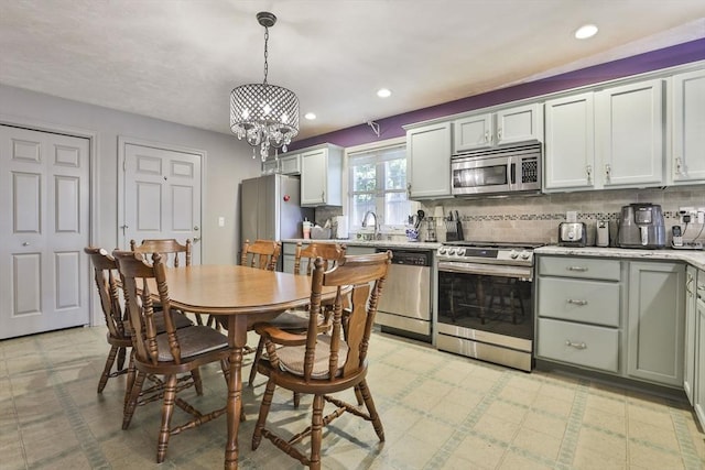 219-221 Wilson St Unit 1, Haverhill, MA 01832 - dining space featuring light floors, a chandelier, and recessed lighting
