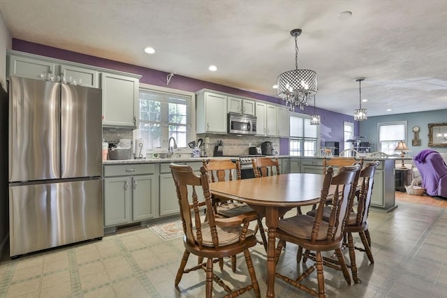 219-221 Wilson St Unit 1, Haverhill, MA 01832 - dining room with plenty of natural light, recessed lighting, light flooring, and a chandelier