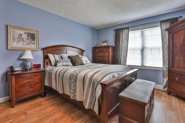 219-221 Wilson St Unit 1, Haverhill, MA 01832 - bedroom with light wood-type flooring and baseboards