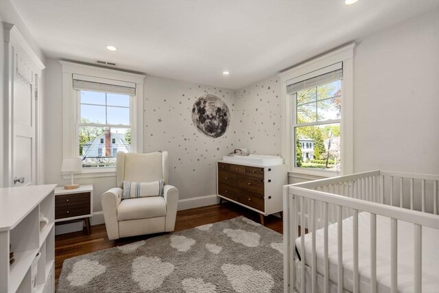 bedroom with multiple windows, recessed lighting, and wood finished floors