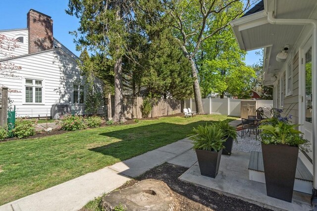 view of yard featuring a fenced backyard and a patio