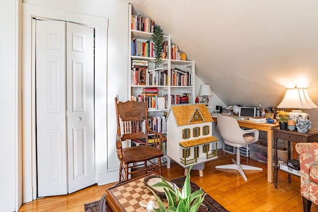 office featuring hardwood / wood-style floors and vaulted ceiling