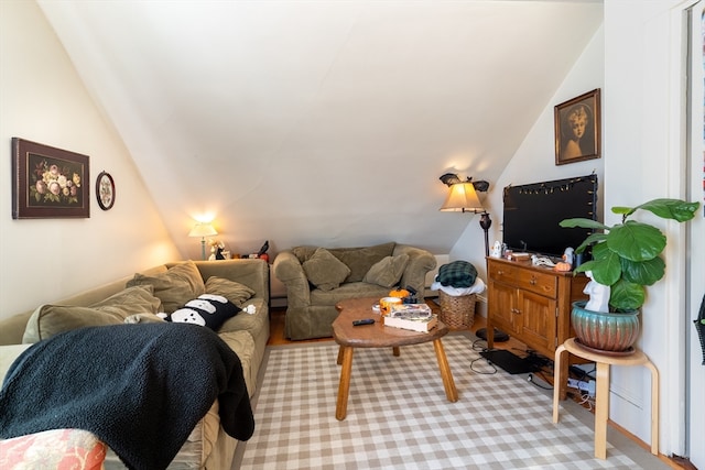 living room featuring vaulted ceiling