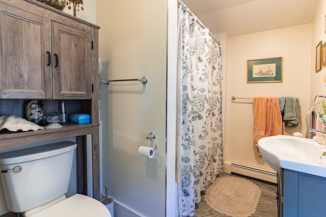 bathroom with toilet, a shower with curtain, vanity, and a baseboard radiator