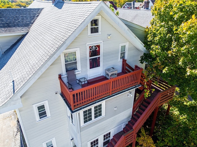 back of house with a wooden deck