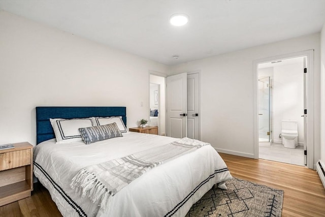 26 Parsons Dr, Swampscott, MA 01907 - bedroom with wood finished floors, baseboards, and ensuite bathroom