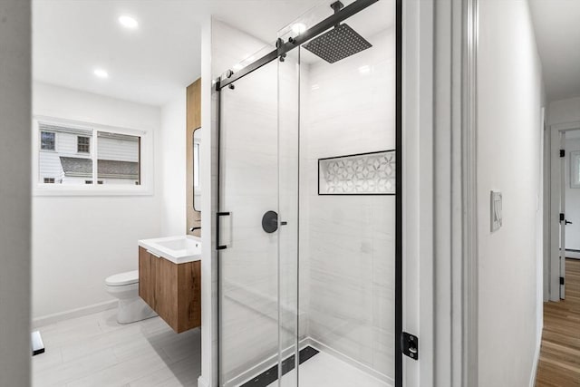 26 Parsons Dr, Swampscott, MA 01907 - bathroom featuring vanity, toilet, a stall shower, baseboards, and recessed lighting