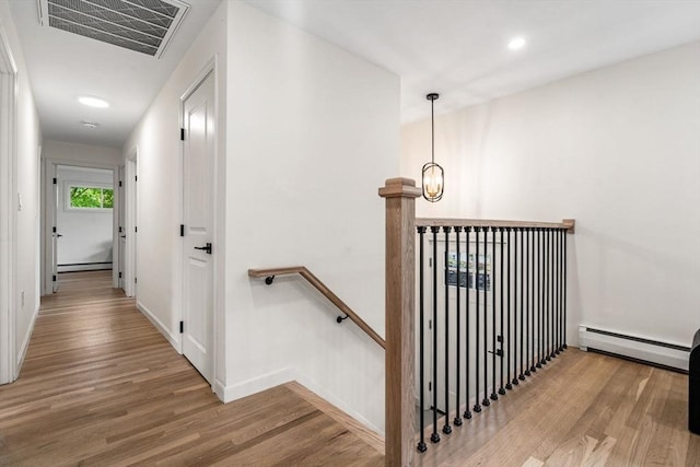 26 Parsons Dr, Swampscott, MA 01907 - corridor with an upstairs landing, baseboard heating, wood finished floors, baseboards, and recessed lighting