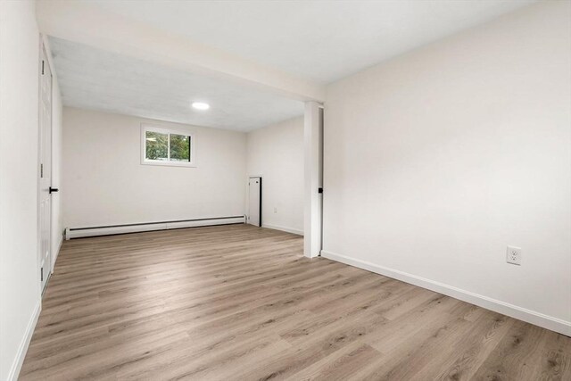 26 Parsons Dr, Swampscott, MA 01907 - empty room with baseboard heating, wood finished floors, and baseboards