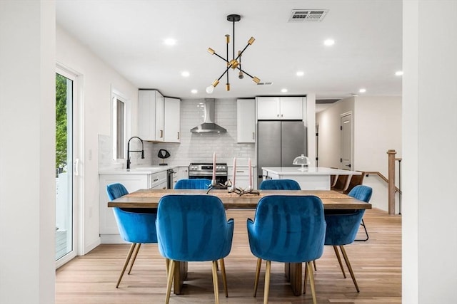 26 Parsons Dr, Swampscott, MA 01907 - dining room featuring light wood finished floors, a chandelier, and recessed lighting