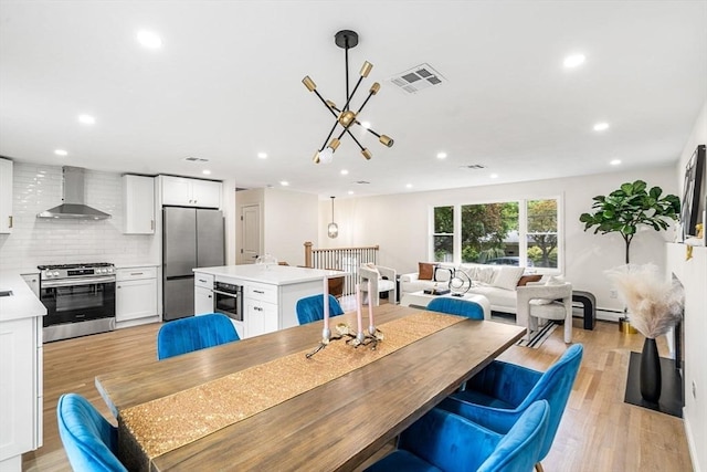 26 Parsons Dr, Swampscott, MA 01907 - dining room with recessed lighting, light wood-type flooring, and a chandelier