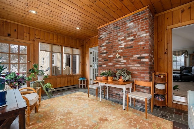 sunroom featuring wooden ceiling and a baseboard heating unit