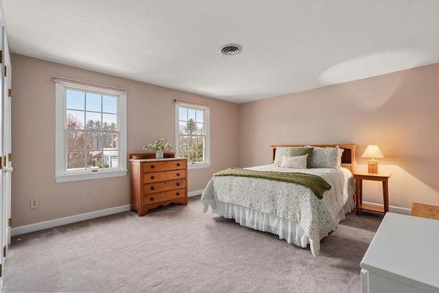 bedroom with carpet flooring, visible vents, and baseboards