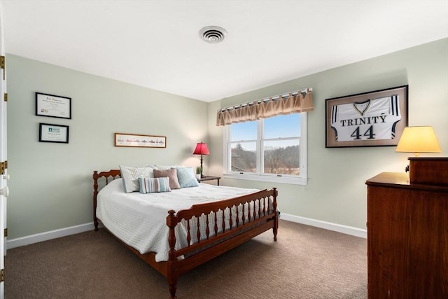 bedroom with carpet floors, visible vents, and baseboards