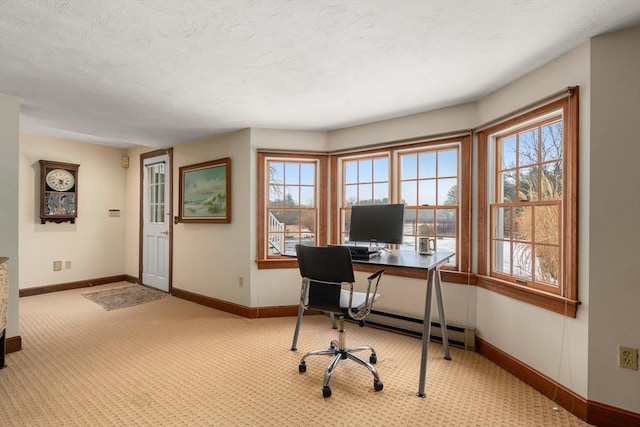 office space featuring baseboards and a wealth of natural light