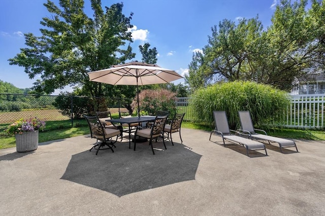 view of patio with outdoor dining area and a fenced backyard