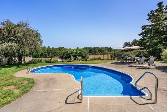 view of pool with a patio area, fence, and a fenced in pool