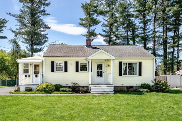 bungalow-style house with a chimney and roof with shingles
