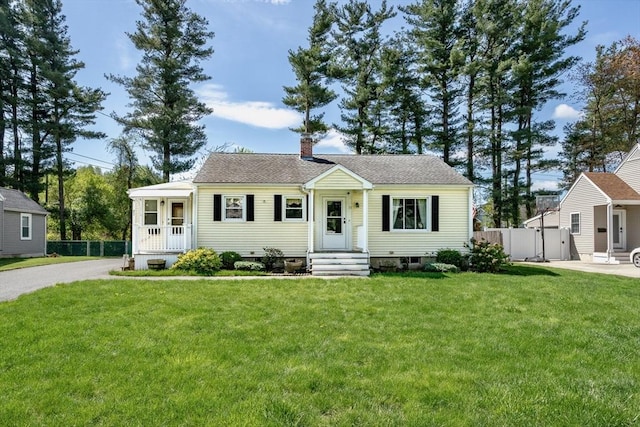 view of front of property featuring a chimney and roof with shingles