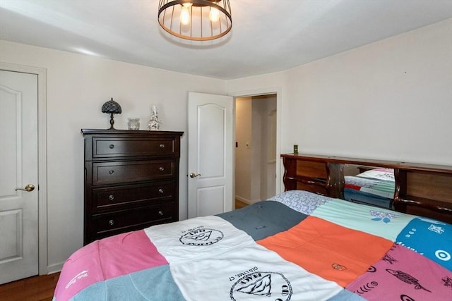 bedroom with wood finished floors