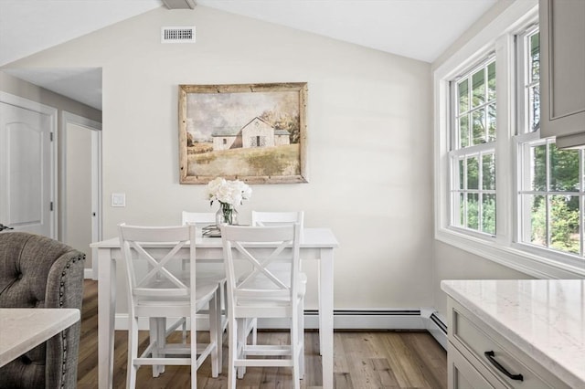 4 Rowley Rd, Topsfield, MA 01983 - dining space with light wood-style flooring and vaulted ceiling