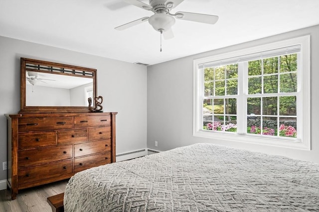 4 Rowley Rd, Topsfield, MA 01983 - bedroom featuring wood finished floors, a baseboard heating unit, ceiling fan, and baseboards