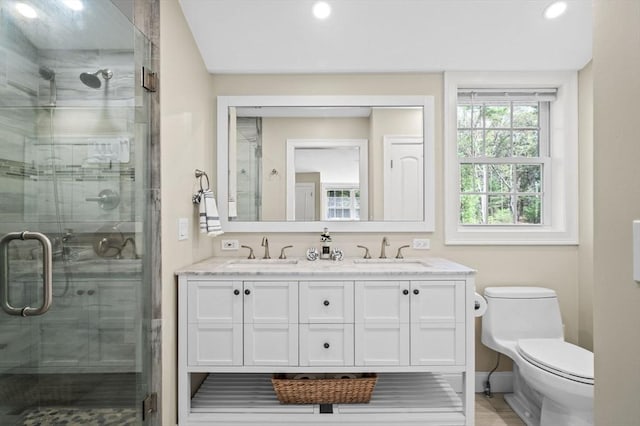 4 Rowley Rd, Topsfield, MA 01983 - bathroom with a shower stall, double vanity, toilet, recessed lighting, and baseboards