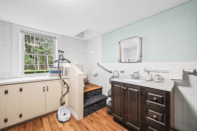 4 Rowley Rd, Topsfield, MA 01983 - bathroom with tile walls, vanity, wood finished floors, and toilet