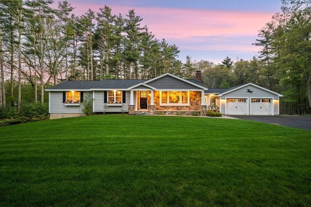 4 Rowley Rd, Topsfield, MA 01983 - ranch-style house featuring driveway, a chimney, a lawn, an attached garage, and view of wooded area