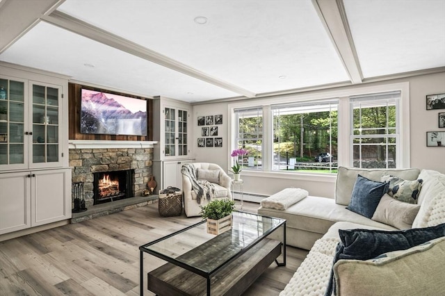 4 Rowley Rd, Topsfield, MA 01983 - living area featuring a baseboard radiator, light wood finished floors, and a stone fireplace