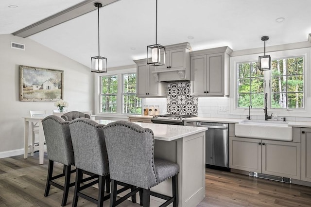 4 Rowley Rd, Topsfield, MA 01983 - kitchen featuring stainless steel appliances, gray cabinetry, a sink, and decorative backsplash