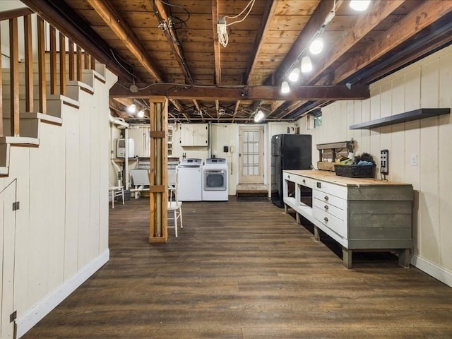 basement with stairway, separate washer and dryer, baseboards, freestanding refrigerator, and dark wood finished floors