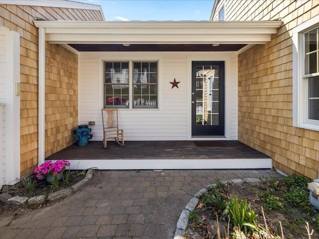 property entrance with covered porch