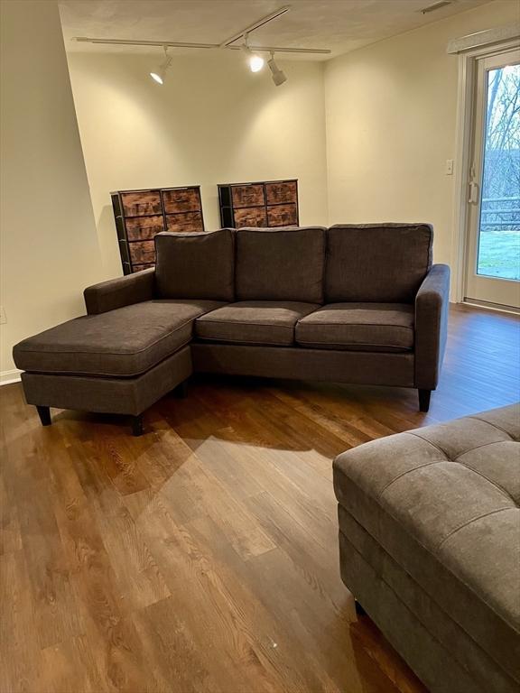 living area with wood finished floors