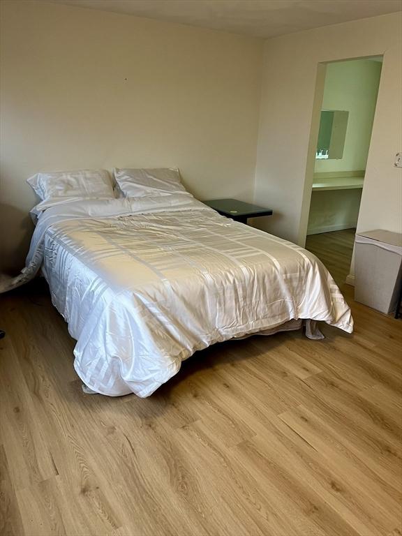 bedroom featuring wood finished floors