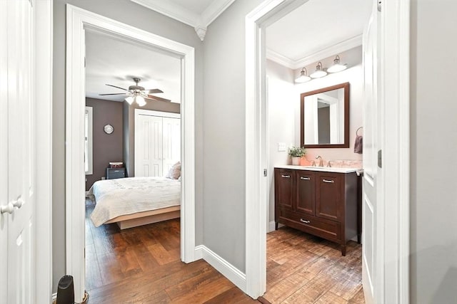 21 Carla Ln, Wilbraham, MA 01095 - bathroom with vanity, ornamental molding, wood finished floors, ceiling fan, and ensuite bathroom