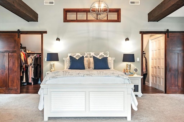 21 Carla Ln, Wilbraham, MA 01095 - bedroom featuring a barn door, a spacious closet, carpet floors, and a closet