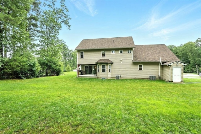 21 Carla Ln, Wilbraham, MA 01095 - back of house featuring a lawn and a shingled roof