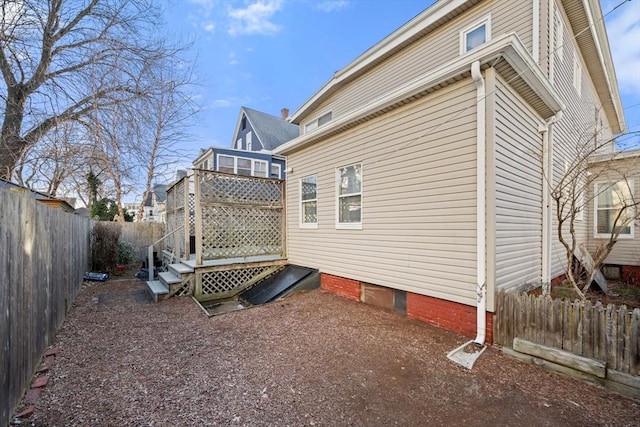 view of side of property featuring a fenced backyard