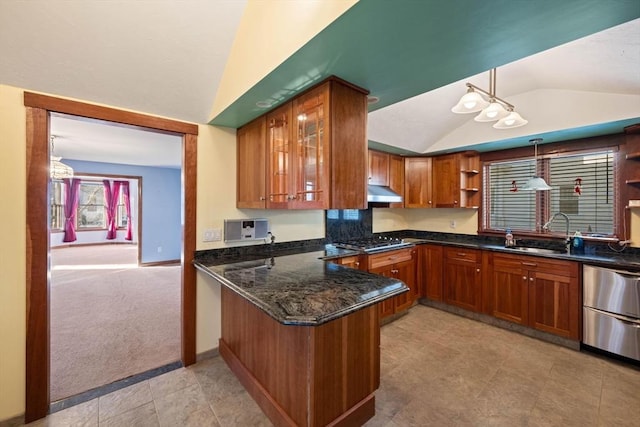 kitchen with open shelves, under cabinet range hood, a sink, a peninsula, and brown cabinetry