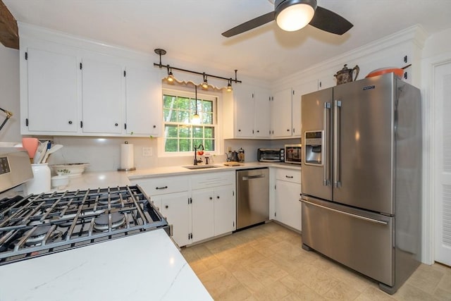 9 Horseshoe Rd, Chelmsford, MA 01824 - kitchen with stainless steel appliances, light countertops, a ceiling fan, white cabinets, and ornamental molding