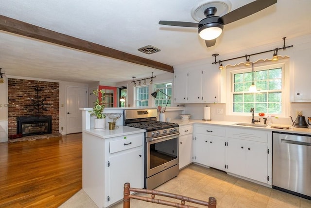 9 Horseshoe Rd, Chelmsford, MA 01824 - kitchen with stainless steel appliances, a peninsula, ceiling fan, white cabinetry, and beamed ceiling