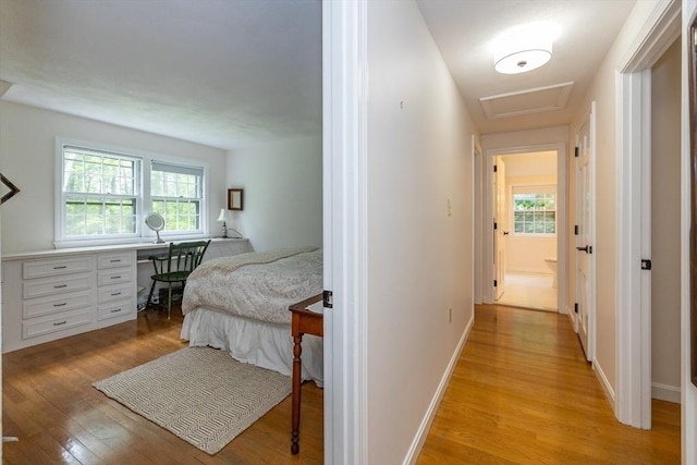 9 Horseshoe Rd, Chelmsford, MA 01824 - bedroom with light wood finished floors, a desk, attic access, and multiple windows