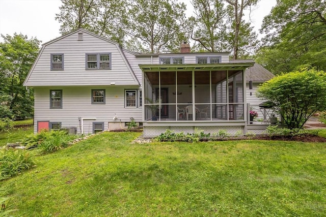 9 Horseshoe Rd, Chelmsford, MA 01824 - back of house with a sunroom, a chimney, a yard, and a gambrel roof