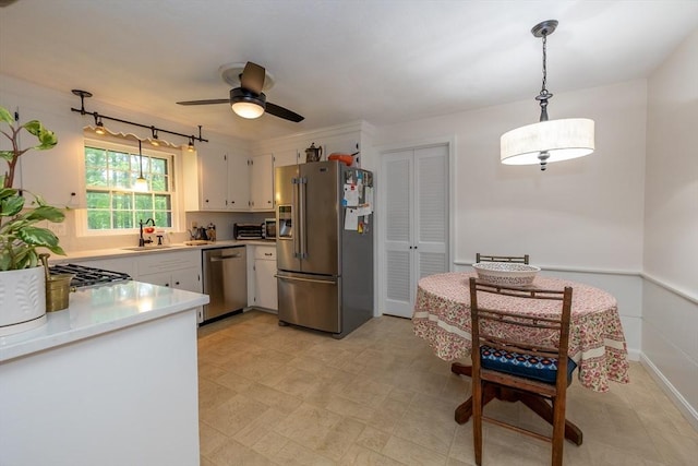9 Horseshoe Rd, Chelmsford, MA 01824 - kitchen with appliances with stainless steel finishes, light countertops, white cabinetry, pendant lighting, and ceiling fan
