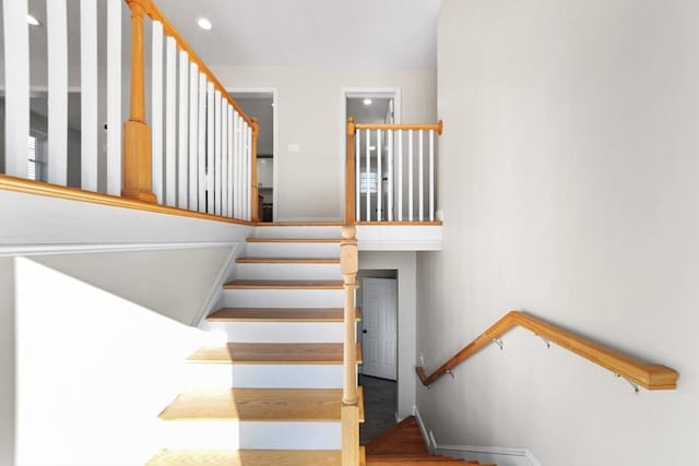 stairway featuring baseboards